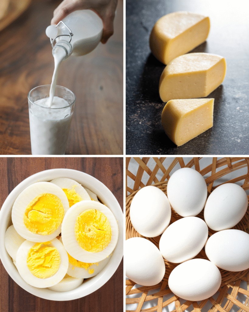 A glass of fresh milk, a block of cheese, and eggs neatly arranged on a wooden table.